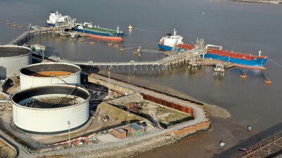 Oil tankers unload at a terminal in Birkenhead, England. Crude prices touched a seven-year high on Wednesday. Getty