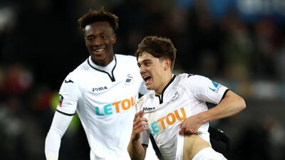 Daniel James of Swansea City, right, celebrates after scoring his side's eighth goal during the FA Cup fourth round match against Notts County at the Liberty Stadium. Catherine Ivill/Getty Images