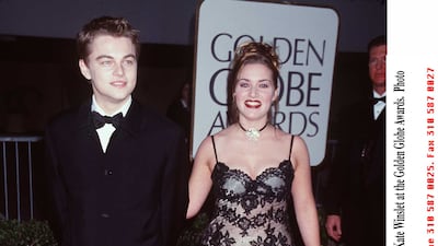 Leonardo DiCaprio, in a black suit and bowtie, and Kate Winslet attend the Golden Globe Awards in Beverly Hills, California, on January 18, 1998. Getty Images