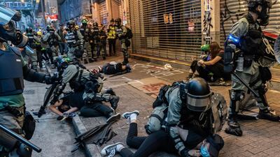 Anti-government protesters are arrested by police during a clash at a demonstration in Wan Chai district in Hong Kong. Getty Images