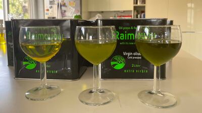 Three samples of Dibbeen olive oil: Left is from last year; middle is this year's crop pressed at 35 degree Celsius using Italian machines; right is also this year's crop, pressed at 15 degree Celsius using German machines. Khaled Yacoub Oweis / The National