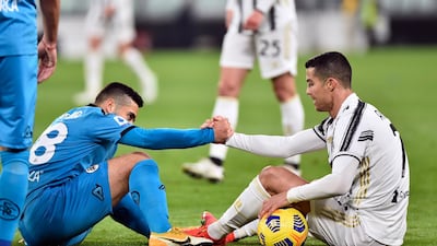 Juventus' Cristiano Ronaldo with Spezia's Leo Sena. Reuters