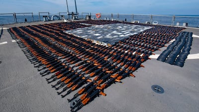 A photo released by the US Navy showing weapons that were seized from a stateless fishing vessel in the North Arabian Sea arranged for inventory on the flight deck of the ‘USS O'Kane'. AP