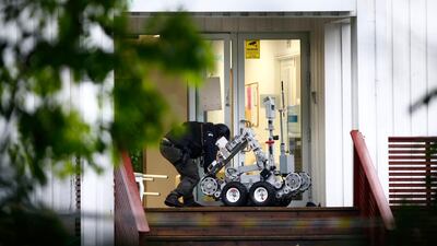 Police on a site of a shooting inside the Al Noor Islamic centre mosque in Baerum outside Oslo, Norway. AP