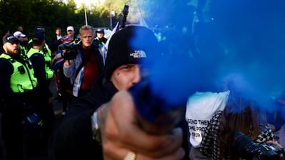 A protest near a hotel after the UK government won a court ruling resulting in asylum seekers not being evicted from the hotel in Epping on Sunday. Reuters