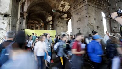 Tourists are seen visiting the ancient Colosseum on Tuesday, October 3, 2017. Andrew Medichini / AP Photo