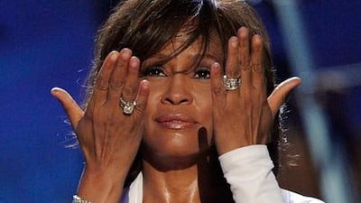 Whitney Houston accepting the Winner of International - Favorite Artist Award onstage at the 2009 American Music Awards. Getty Images / AFP
