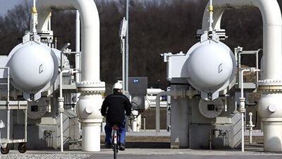 A worker rides a bicycle past gas pipes at Gas Connect Austria's gas distribution node in Baumgarten. Nabucco West, the OMV-led consortium that was bidding to build a pipeline to bring Azeri gas to Europe, has not been selected by the gas field's operators Heinz-Peter Bader / Reuters