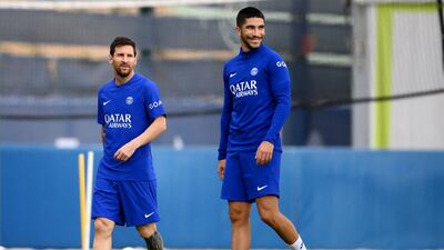 PSG's Lionel Messi and Carlos Soler at training. AFP