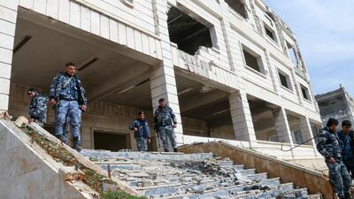 Members of the Syrian security forces take control of the police academy complex in Khan Al Asal in Aleppo province. AFP