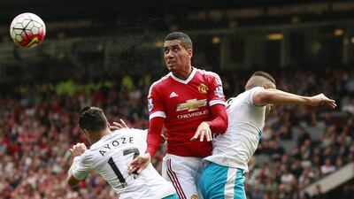 Manchester United's Chris Smalling heads over Newcastle United players during their Premier League match on Saturday at Old Trafford. Jason Cairnduff / Action Images / Reuters / August 22, 2015