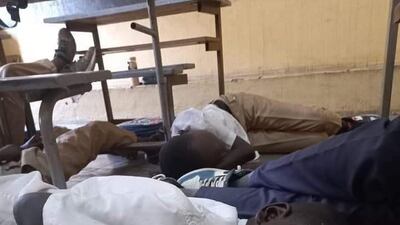 Schoolboys on the floor of their classrooms during the conflict