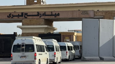 Minibuses carrying Palestinians returning to the Gaza Strip line up on the Egyptian side of the Rafah border crossing on March 19. AFP