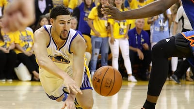 Klay Thompson #11 of the Golden State Warriors passes the ball in Game Seven of the Western Conference Finals against the Oklahoma City Thunder during the 2016 NBA Playoffs at ORACLE Arena on May 30, 2016 in Oakland, California. Ezra Shaw/Getty Images/AFP