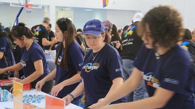 Some 200 volunteers helped assemble 6,000 backpacks filled with school supplies for children from low-income families. Wam