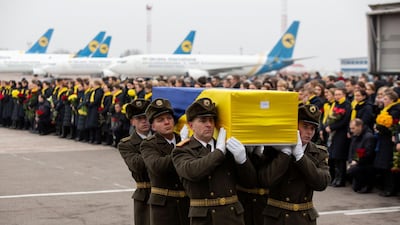 Soldiers carry a coffin containing the remains of one of the eleven Ukrainian victims of the Ukraine International Airlines flight 752 plane disaster during a memorial ceremony at the Boryspil International Airport, outside Kiev, Ukraine January 19, 2020. Reuters.