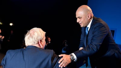 Sajid Javid is greeted by Boris Johnson in 2019. EPA