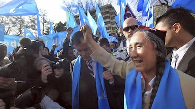Members of the Uighur community in Melbourne, Australia, cheer their support for Uighur activist Rebiya Kadeer, right, outside the Chinese consulate in Melbourne last month.