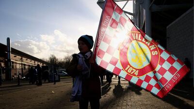 An Aston Villa fan brings a club flag to the King Power Stadium before his team's loss to Leicester City in the Premier League on Saturday. Mark Thompson / Getty Images / January 10, 2015