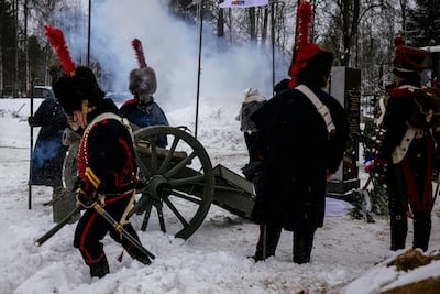 Re-enactors in period uniforms attend a burial ceremony of 126 people killed in one of the bloodiest battles of Napoleon's Russian campaign. / AFP / Dimitar DILKOFF