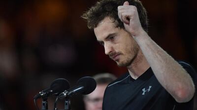Britain's Andy Murray speaks before being presented with the runner's up trophy after he was defeated by Serbia's Novak Djokovic in their men's singles final match on day fourteen of the 2016 Australian Open tennis tournament in Melbourne on January 31, 2016. AFP PHOTO / PAUL CROCK