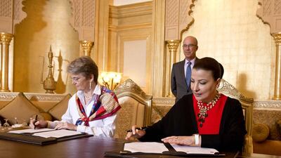 A handout photo of Gran Teatre del Liceu's artistic & production director general, Christina Scheppelmann (L), signs letter of agreement with Abu Dhabi Music and Arts (ADMAF) founder Hoda Al Khamis-Kanoo. (Courtesy: ADMAF)
