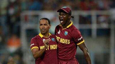 Samuel Badree, left, of the West Indies celebrates with Darren Sammy after dismissing Jason Roy of England during the ICC World Twenty20 India 2016 Final at Eden Gardens on April 3, 2016 in Kolkata, India. Agency