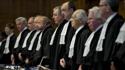 Presiding judge Peter Tomka, fourth from right, opens the World Court session in The Hague, Netherlands on February 3, 2015. Peter Dejong/AP Photo