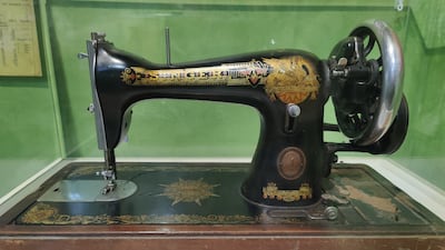 A vintage Singer sewing machine carried by one refugee across the border
