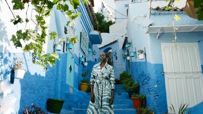 Denim coat, Dh11,317, Roberto Cavalli. Boots, Dh4,200, Bottega Veneta. Earrings, Dh55, Asos