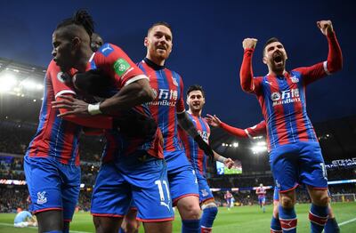 Crystal Palace players celebrate after Fernandinho's late own goal earned them a point at Manchester City. Getty