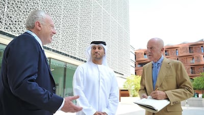 Masdar City director Anthony Mallows, left, and Masdar City chief executive Dr Ahmad Belhoul, centre, with Lord Norman Foster, the original designer of Masdar City’s masterplan. Courtesy APCO Worldwide