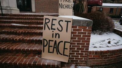 Signs on the steps of Mississippi Boulevard Christian Church on the morning of the funeral. Getty / AFP
