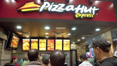 Americana owns exclusive rights to franchise KFC and Pizza Hut across the Middle East. Jaime Puebla / The National