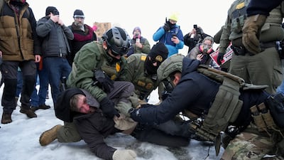 Border Patrol federal agents detain a demonstrator at a protest in Minneapolis. Reuters