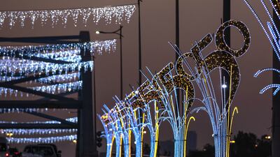 Al Maqta Bridge in Abu Dhabi with UAE at 50 National Day lights. Victor Besa / The National