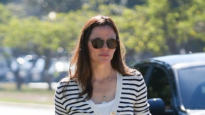 Jennifer Garner wears the classic pairing of striped cropped cardigan with jeans. Getty Images