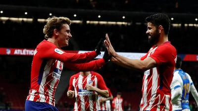 Antoine Griezmann celebrates scoring his and Atletico Madrid’s fourth goal against Leganes with Diego Costa. Juan Medina / Reuters