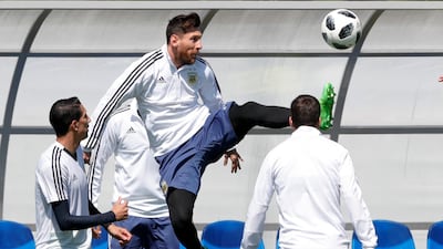 Lionel Messi plays the ball during training with his Argentina teammates. Ricardo Mazalan / AP Photo