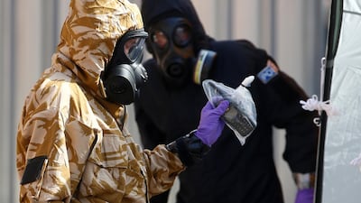 Forensic investigators search the homes of two people stricken by nerve agent. REUTERS