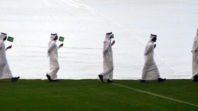 Saudis perform during the opening ceremony of the 22nd Gulf Cup football tournament prior to Saudi Arabia’s match against Qatar in Riyadh on November 13, 2014. Eight nations are taking part in the games including Oman, UAE, Kuwait, Yemen, Bahrain, Iraq, Saudi Arabia and Qatar. AFP PHOTO/KARIM SAHIB