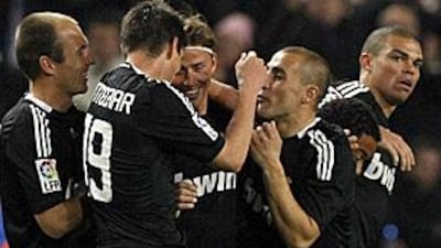 Real Madrid players celebrate a goal against Espanyol as the club go on to record their tenth win in a row.