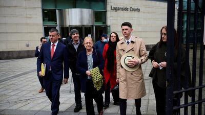 Solicitor for the McCann family, Niall Murphy, with Joe McCann's family, (L-R) son Fergal, widow Anne, daughter Nuala, nephew Fergal and daughter Aine. Reuters