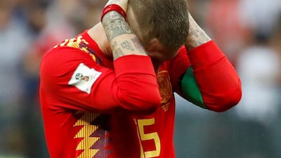 Spain's Sergio Ramos looks dejected after losing the penalty shoot-out to Russia. Christian Hartmann / Reuters