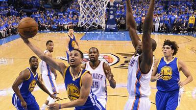 Golden State Warriors player Stephen Curry, left, goes to the basket against Oklahoma City Thunder player Serge Ibaka of Congo, right, in the first half of their NBA Western Conference Finals Game 6 at Chesapeake Energy Arena in Oklahoma City, Oklahoma, USA, 28 May 2016. The winner of this series goes on to play the Cleveland Cavaliers in the NBA Finals. EPA/TYLER SMITH