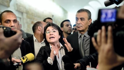 Arab member of Israel's Knesset Haneen Zoabi (C) speaks to the press after the court decision about Israels ban of Arab lawmaker Zoabi from election in Jerusalem on February 14, 2015. Getty