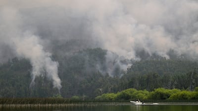 A wildfire burns behind Lago Epuyen in the Patagonian province of Chubut, in Argentina. Reuters