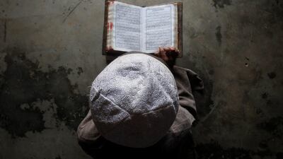A Muslim boy learns to read the Quran at a madrasa near Agartala, India. Jayanta Dey / Reuters