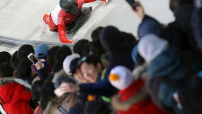 Matthias Guggenberger of Austria brakes in the finish area during the men's skeleton competition at the 2018 Winter Olympics. Michael Sohn / AP Photo
