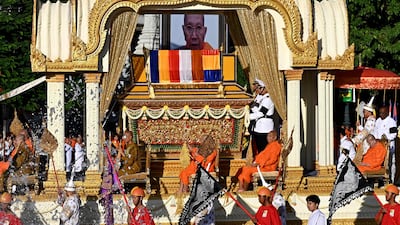 The coffin of Tep Vong, the leader of Cambodia's Buddhist community, sits on a golden dragon float during a funeral procession before his cremation in Phnom Penh. AFP